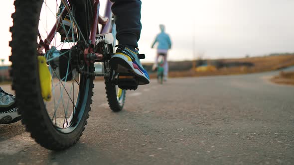 Close Up of Bike Wheels Driving on Road