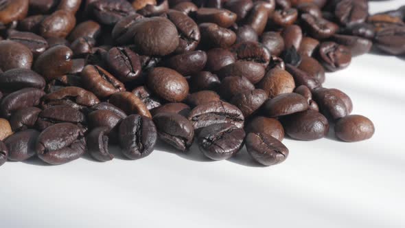 Coffee background with roasted beans 4K tilting footage