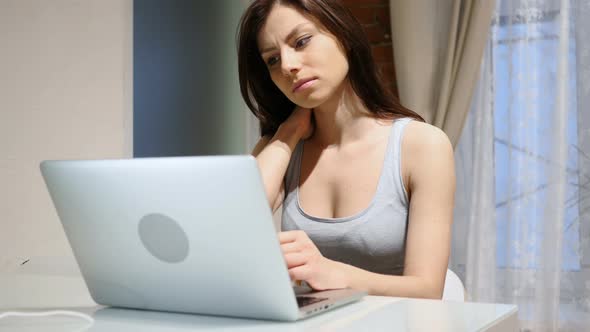 Tired Woman, Girl Relaxing Muscles, while Working on Laptop