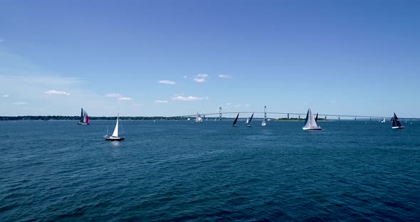 Sailboats entering and leaving Mt. Hope Bay in Newport Rhode Island as well as returning from Block