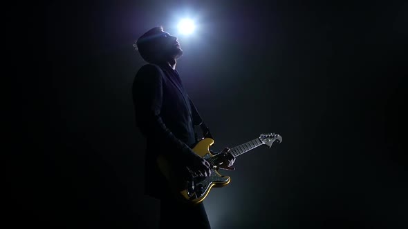 Electric Guitar Yellow Color. Man Performs a Concert. Slow Motion