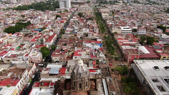 Populated Urban City Of Guadalajara Mexico And The Virgen de Guadalupe Cathedral - aerial view