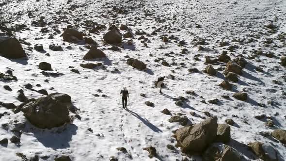Mountaineer Walking Uphill
