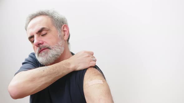 Immunization of the Elderly People  Caucasian Man Showing the Vaccination Arm Patch Influenza