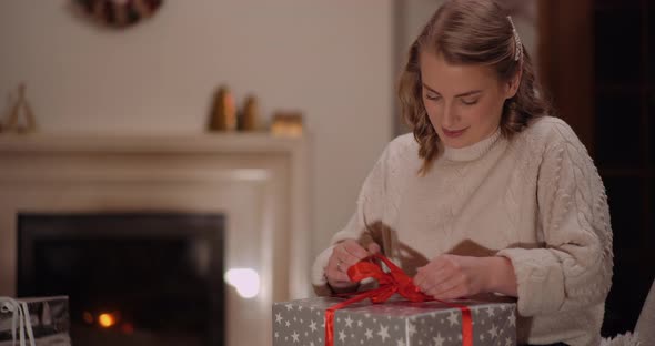 Happy Woman Unboxing Christmas Gift