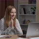 Overjoyed young woman surprised victory looks at the laptop sitting in the office - VideoHive Item for Sale