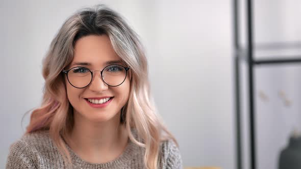 Closeup Female in Glasses Smiling Dental Laugh Showing Healthy Teeth