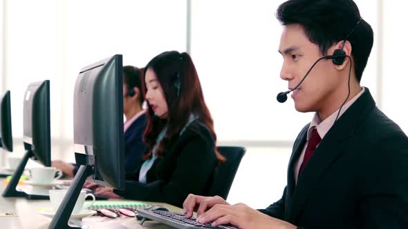 Business People Wearing Headset Working in Office