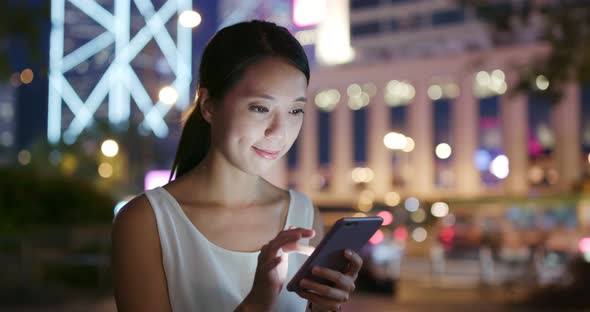 Woman use of cellphone at night