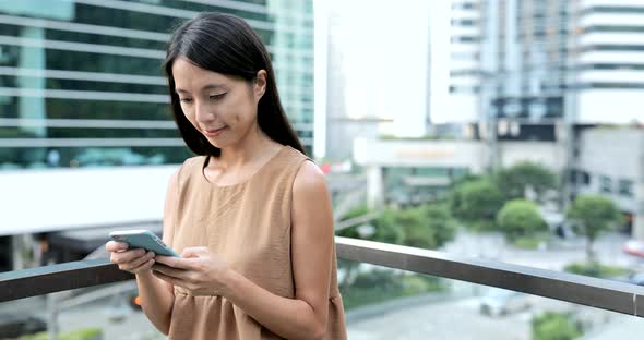 Woman Use of Mobile Phone in The City 