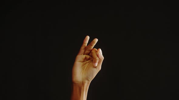 African American Man Counting Fingers Isolated on Black Background