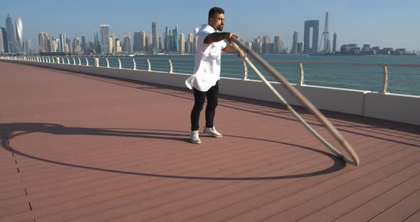 Young Athlete is Doing Wheel Gymnastics in Dubai on a Sunny Day