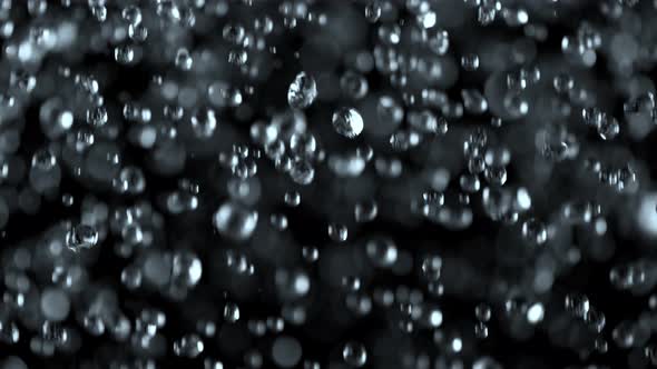 Super Slow Motion Shot of Falling Water Drops Isolated on Black Background at 1000 Fps.