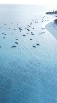 Boat Boats in the Ocean Near the Coast of Zanzibar Tanzania Slow Motion Vertical Video