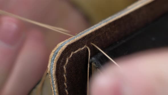 The Tanner Sews the Leather Workpieces