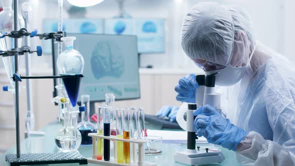 Dolly Shot of Scientist Team Working in Modern Laboratory alt