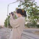 Asian woman standing and taking a picture of the river view - VideoHive Item for Sale