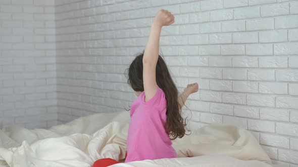 Cute kid wakes up.  alt