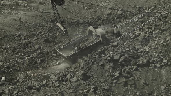 Quarry Walking Excavator with Giant Bucket Removes Layer of Coal in Open Pit