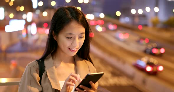 Woman Use of Cellphone for Online at Night