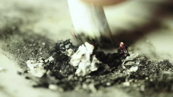 Smoking. A Cigarette in an Ashtray. Close-up. Macro