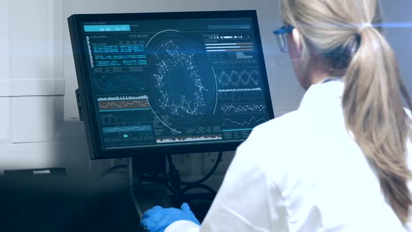 Doctor Looking DNA Molecule on Computer