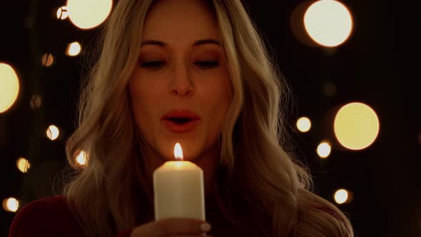 Attractive Woman Holding A Candle