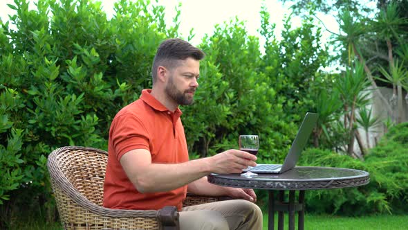 Man Works on a Laptop