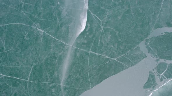 Ice patterns on a frozen lake surface