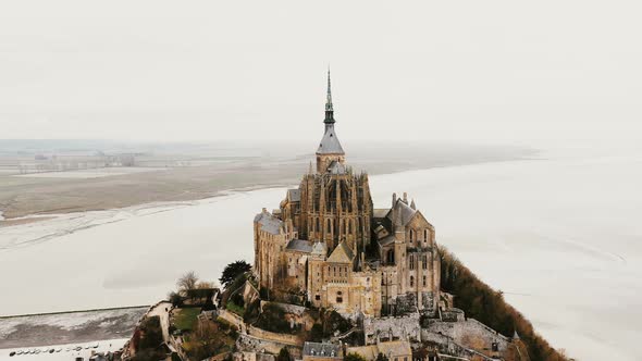 Amazing Aerial View, Drone Flying Right Around Mont Saint Michel Abbey in Famous Tidal Island Town