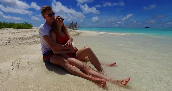 Fun lady and man after marriage in love spend quality time on beach on white sand 4K background