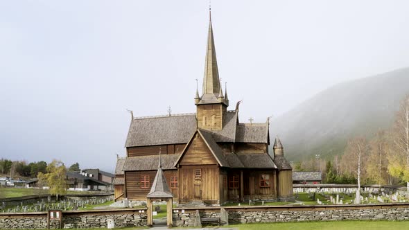 Medieval Structure Of Wooden Stave Church In Lom, Innlandet county, Norway. Aerial Drone