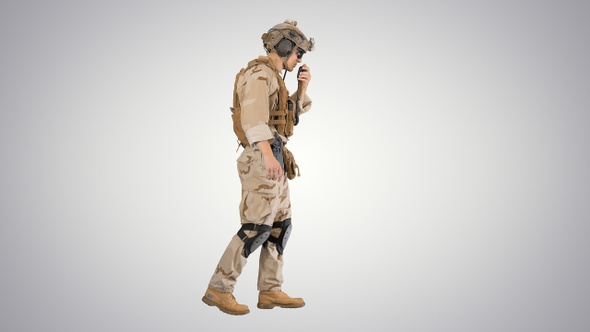 Military Man Marine Walking and Using Radio on Gradient Background