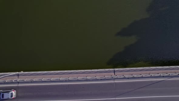 Car Driving Over Bridge