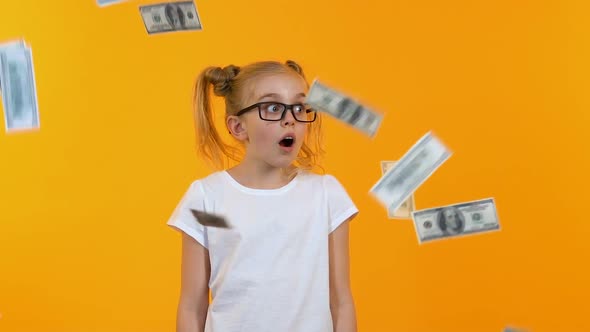 Surprised Girl Looking at Falling From Sky Dollars, Clever Girl Win Prize, Grant