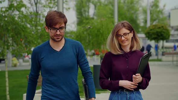 Business people walking together out of office building