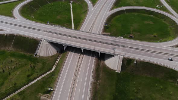 Aerial View of a Suburban Interchange with Few Moving Vehicles