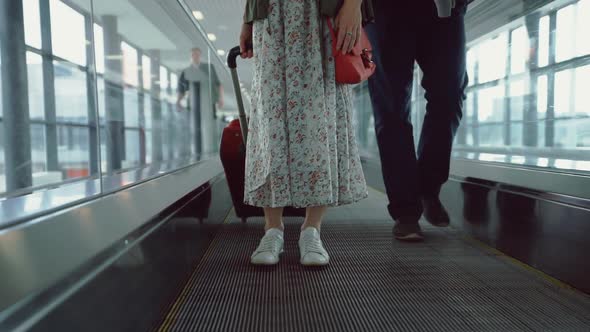 Attractive girl with a suitcase at the airport