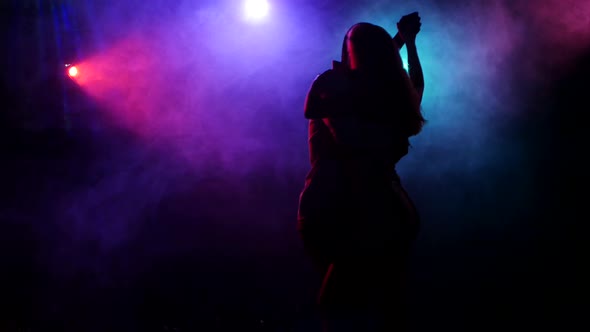 Silhouette of Dancing Couple Latin American Dance in Disco Style