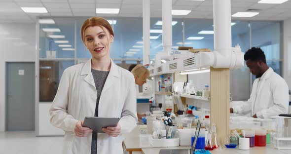 Female Scientist with Pc Tablet Doing Research Study