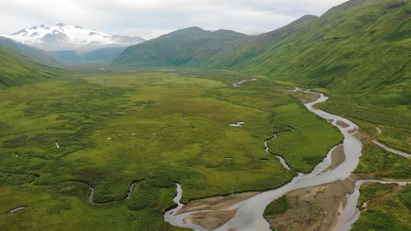 Aerial view of a river streaming from the glacier, Alaska, United States.