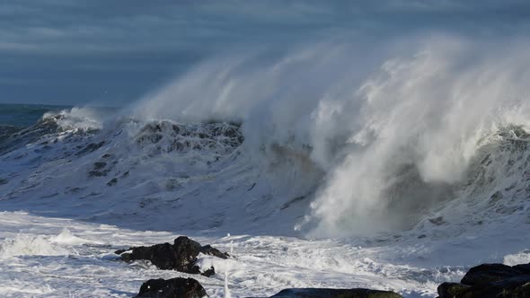 Ocean Waves Crashing To Rocky Shore