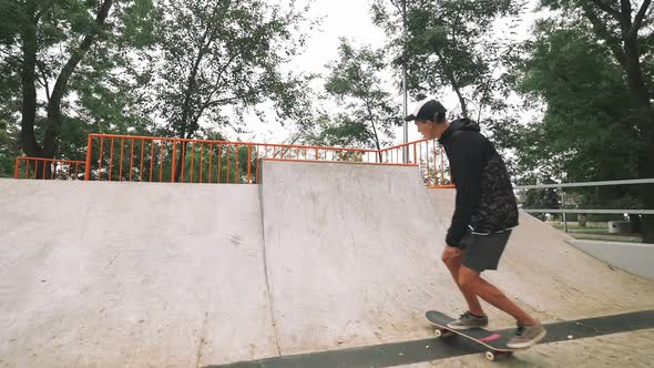 Skateboarder in Skate Park Doing Tricks Slow Motion