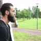 portrait young beautiful bearded man outdoor looking away - VideoHive Item for Sale