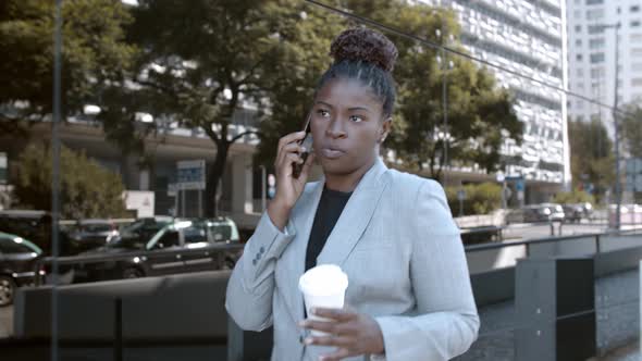 Confident African American Manager Walking Down City Street