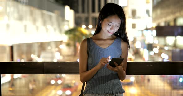 Woman Looking at Mobile Phone in Hong Kong City