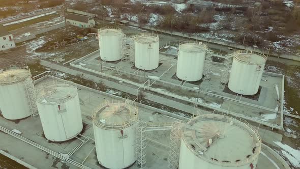 Aerial footage of big fuel reservoires in petrol industrial zone.