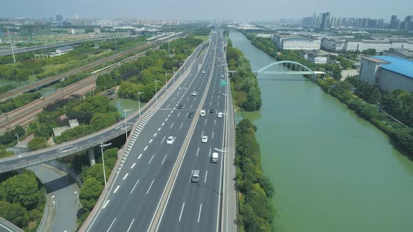 Aerial Drone View of Highway Multilevel Junction Road with Moving Cars at Daytime