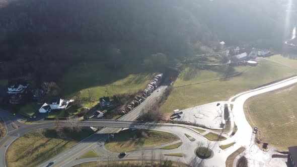 North entrance of subsea tunnel Mastrafjordtunnel along E39 coastal road Norway - Sunny day aerial s