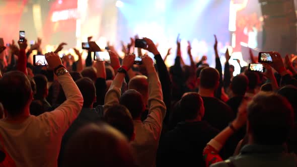 People applaud at live music concert